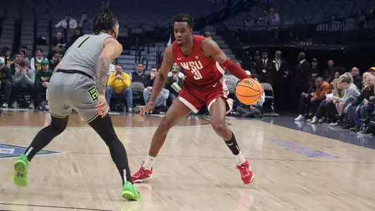 Kymany Houinsou looks to drive against Baylor