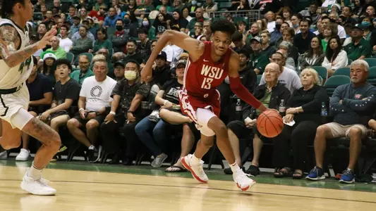 Carlos Rosario drives on a Hawaii defender