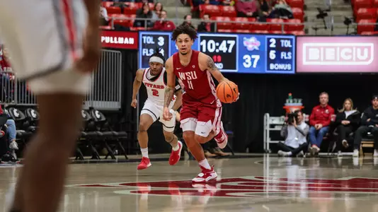 DJ Rodman brings the ball up the court against Detroit Mercy