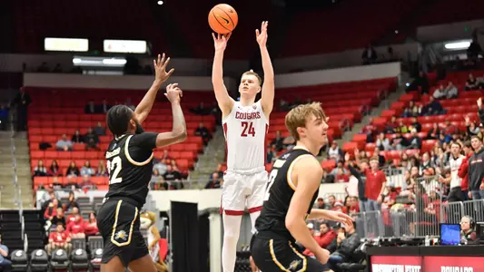Justin Powell shoots over an NKU defender