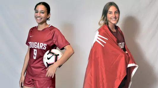 Aaliyah Bluett and Sydney Studer pose for a photo upon signing with WSU
