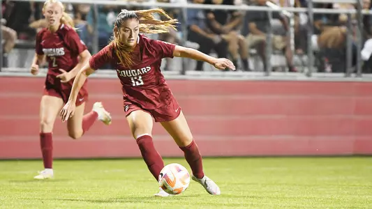 Brianna McReynolds dribbles near Reese Tappan during a match against Portland