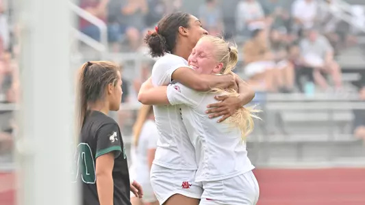 WSU's Margie Detrizio and Lindsey Turner celebrate Turner's first career goal