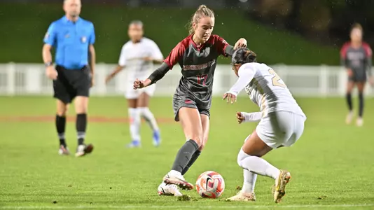 Lily Boyden dribbles at a Colorado defender