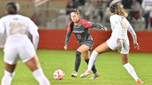 Brianna McReynolds dribbles at a Colorado defender