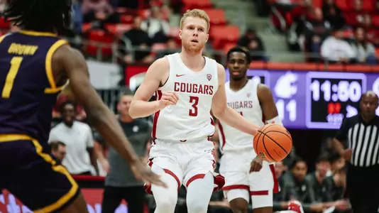 Jabe Mullins brings the ball up the court against Cal