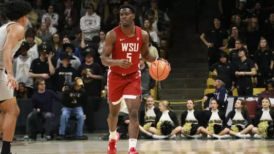 TJ Bamba brings the ball up the floor against Colorado