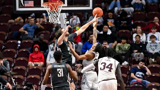 Oscar Cluff blocks a shot against Mississippi State, Nov. 18, 2023