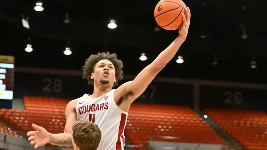 DJ Rodman rises over an Oregon State defender for a layup