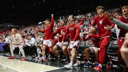 The WSU bench celebrates a made basket against Oregon