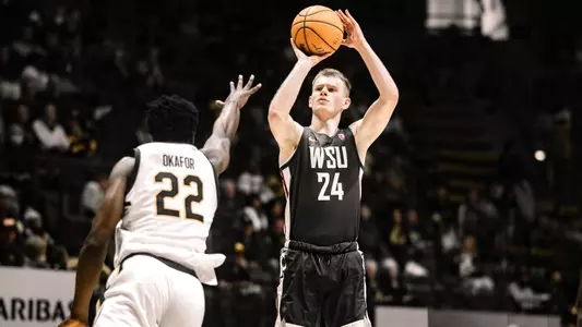 Justin Powell rises for a 3-point jump shot over a California defender