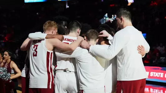 WSU team huddles before tipoff against Cal in the Pac-12 Tournament