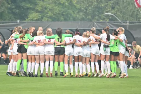 The Cougs huddle during a 2022 match