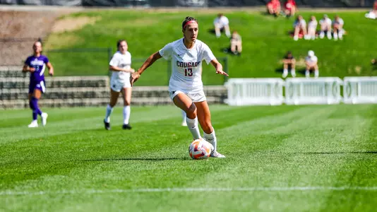 Reagan Kotschau dribbles against Weber State