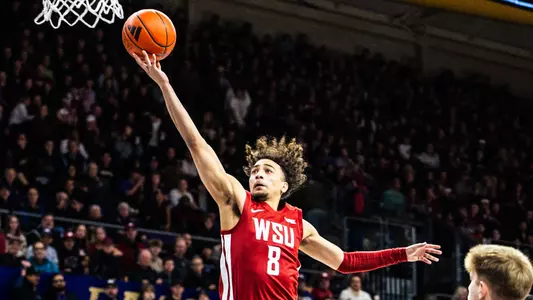 Nate Calmese drives for a layup against Washington, Dec. 18, 2024
