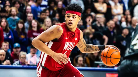 LeJuan Watts dribbles against Washington, Dec. 18, 2024