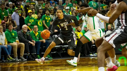 Myles Rice drives on an Oregon defender, Feb. 10, 2024