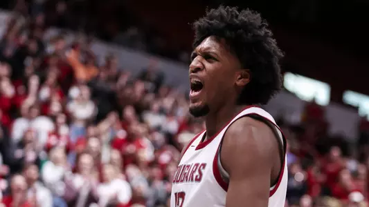 Isaac Jones celebrates after a dunk against Stanford, Deb. 17, 2024