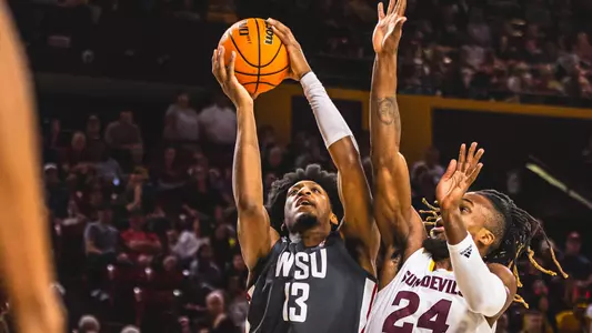 Isaac Jones rises for a shot against Arizona State, Feb. 24, 2024