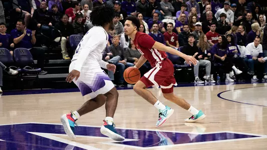 Myles Rice drives past a Washington defender, Feb. 3, 2024