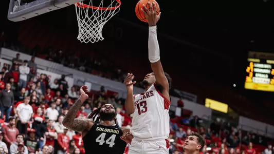 Isaac Jones shoots over a Colorado defender, Jan. 27, 2024