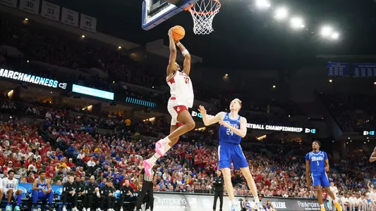 Isaac Jones rises for a dunk against Drake, March 21, 2024