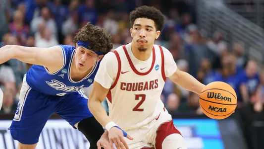 Myles Rice drives against a Drake defender, March 21, 2024