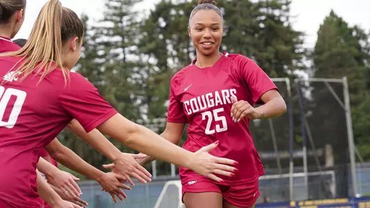 Bryana Pizarro high-fives teammates before facing California