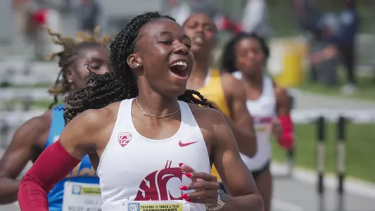 Caicedo celebrates after breaking the school record in the 100-meter hurdles
