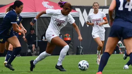 Naomi Clark dribbles against UC San Diego, Sept. 8, 2024