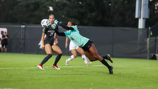 Nadia Cooper punches a save while Peyton Price looks on, Sept. 5, 2024