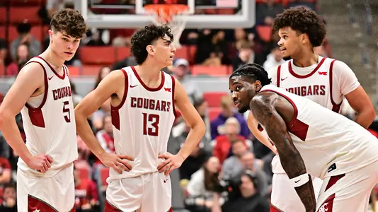 The Cougars huddle during a free throw, Nov. 14, 2025