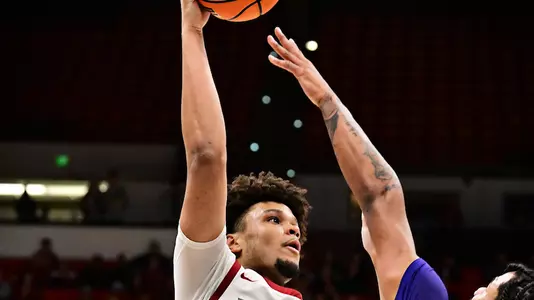 Eemeli Yalaho rises for a hook shot against Washington, Nov. 14, 2025