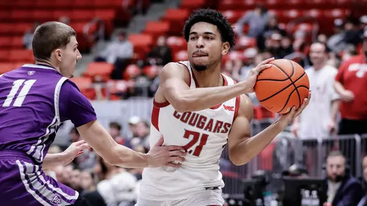 Ace Glass looks to pass against St. Thomas