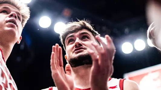 Ethan Price and Dane Erikstrup encourage the team against San Diego, Feb. 27