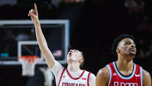 Rihards Vavers celebrates a made 3-pointer against LMU, March 8, 2025