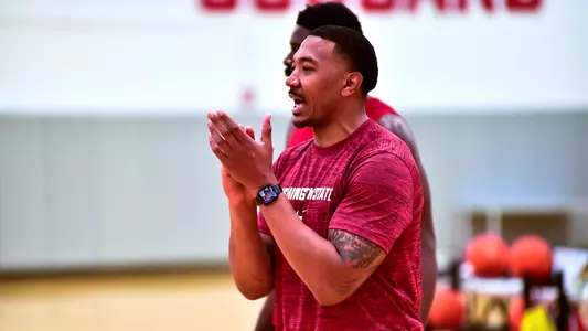 Orlando Johnson encourages the team during a summer workout