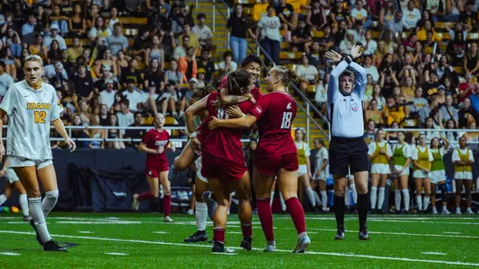 Audrey Shackelford celebrates with teammates after scoring her first career goal