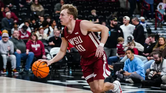 Parker Gerrits brings the ball up the court against EWU