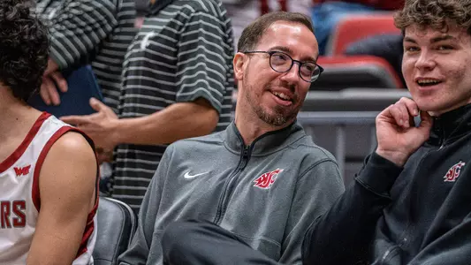 Pedro Garcia Rosado talks with Tomas Thrastarson on the bench