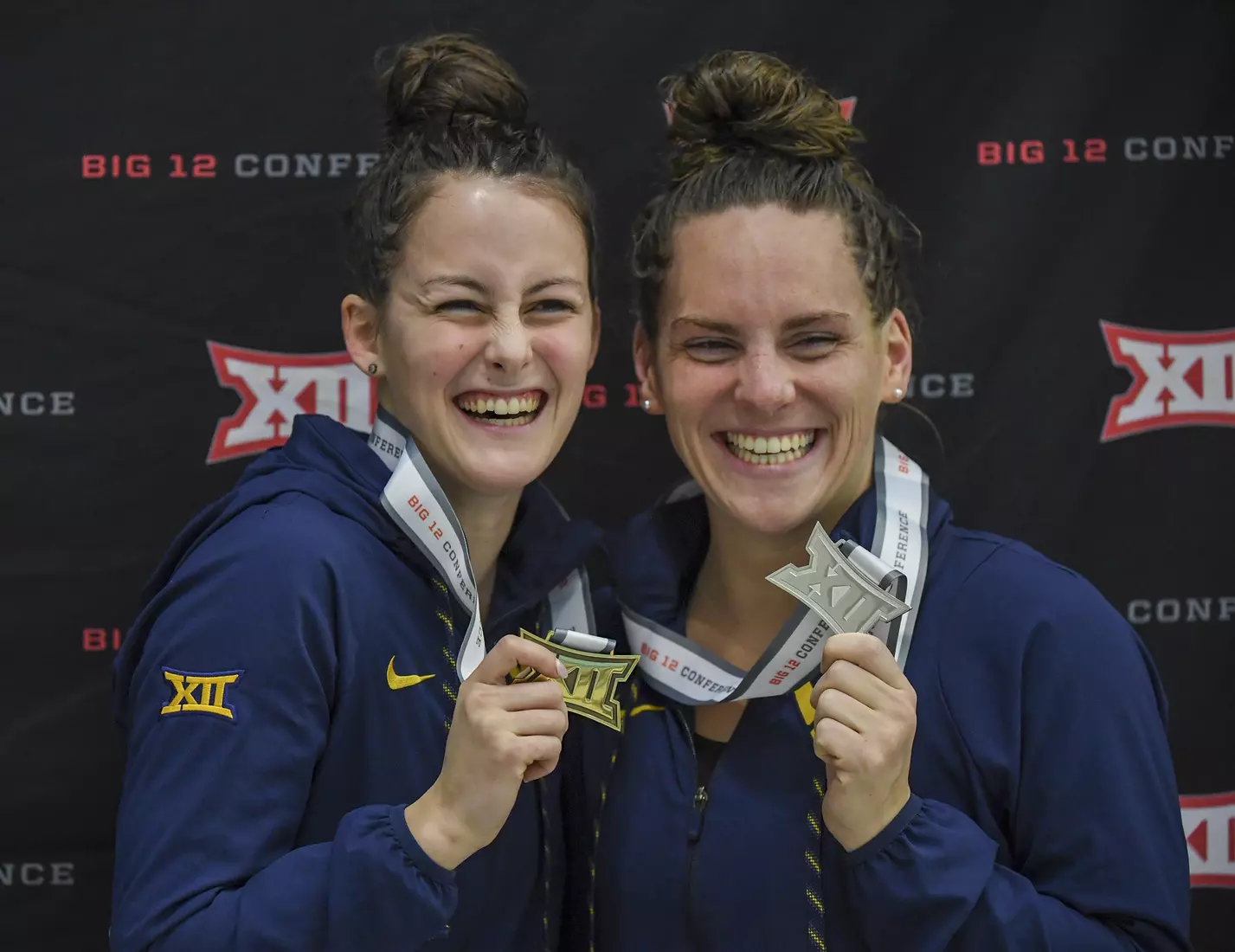 Reka Kovacs and Morgan Bullock show-off their 200 Fly medals.