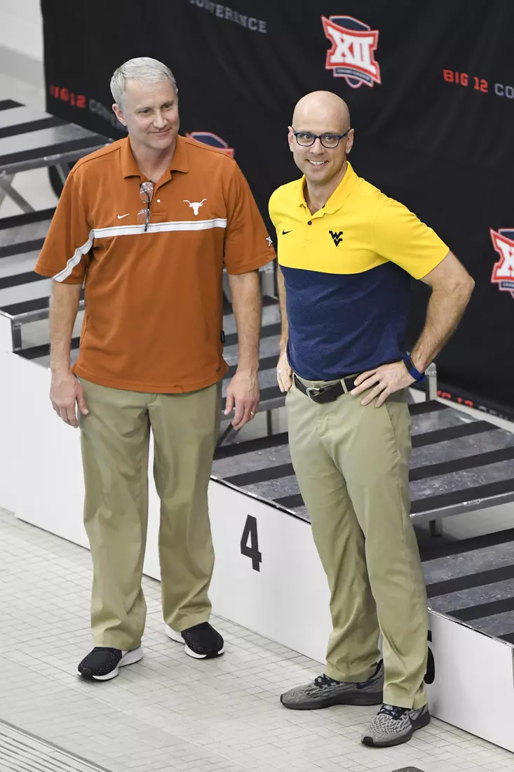 Diving coach Mike Grapner (right) was named co-coach of the meet with Texas' Matt Scoggin.