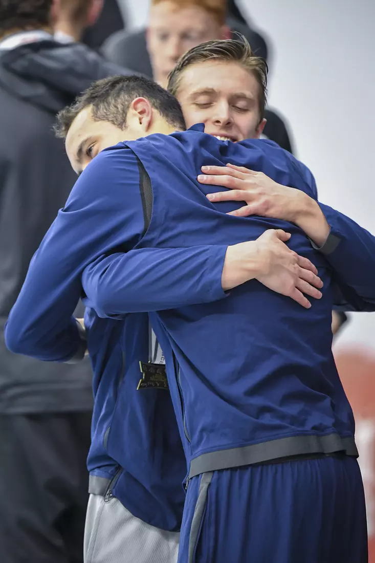 Jack Portman and Fausto Huerta hug on the awards podium.