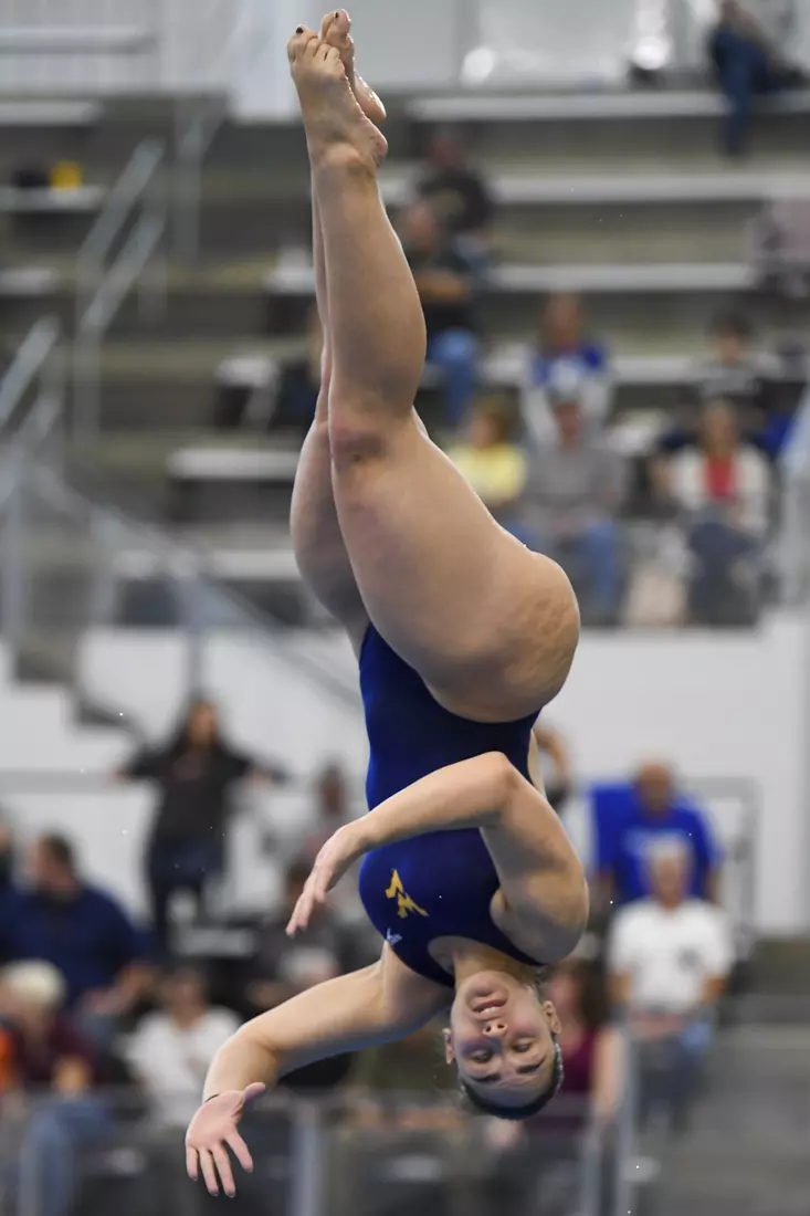 Callie Smith dives in the one meter event.
