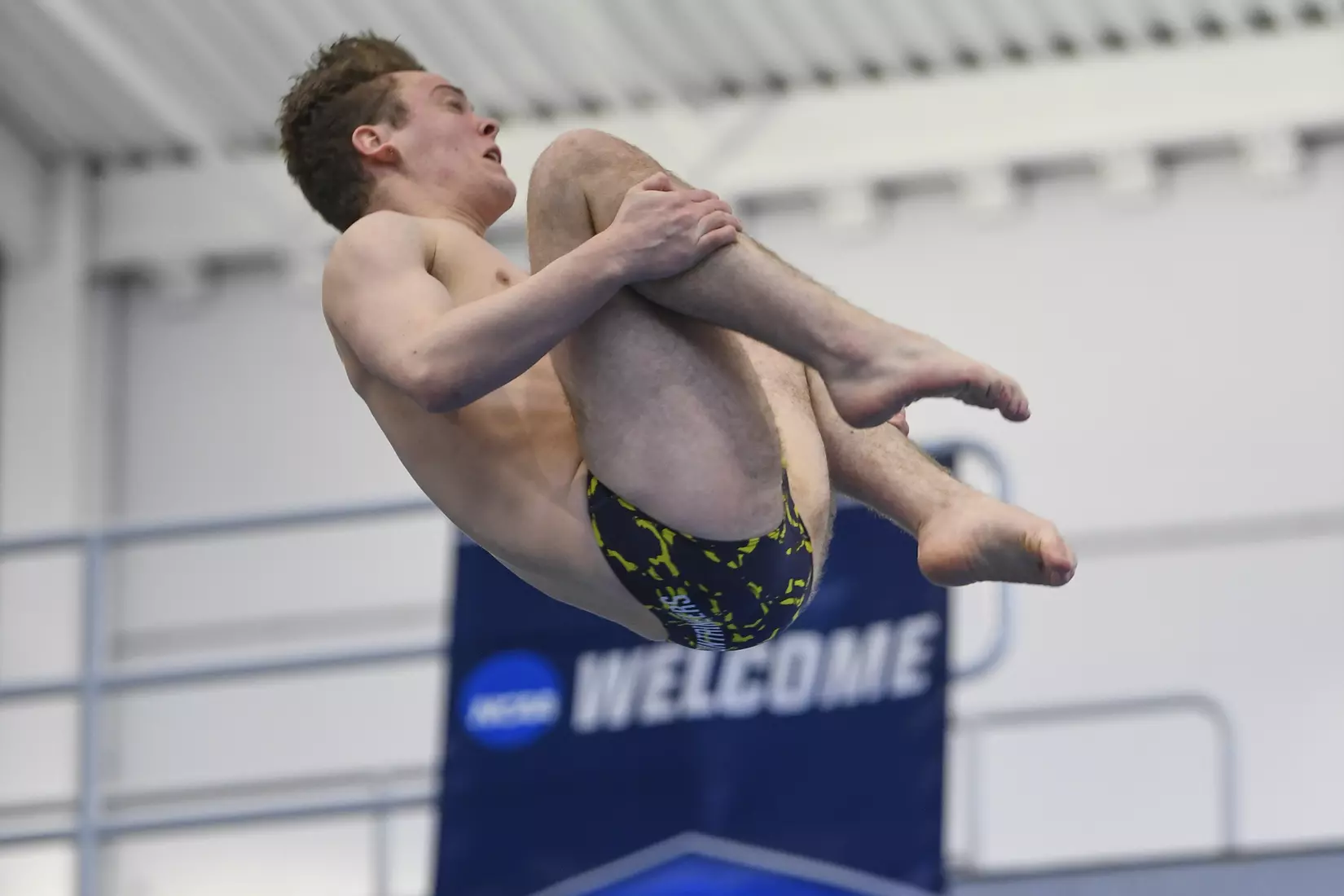 Owen Johns dives in the three meter event.