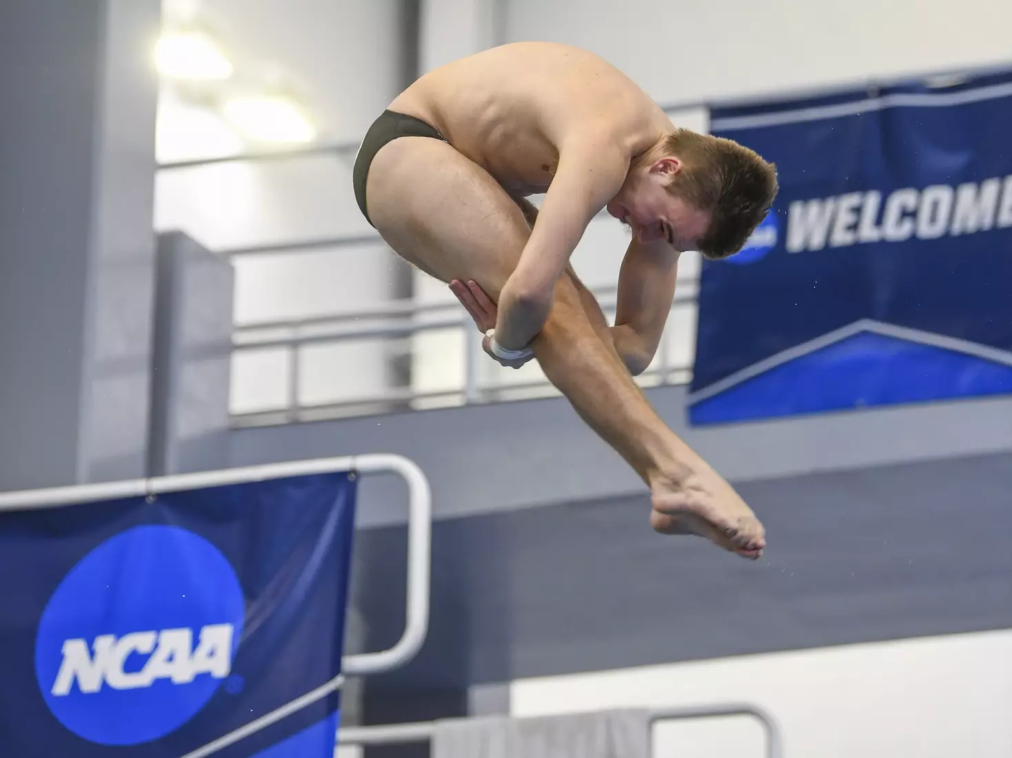 Nick Cover dives in the three meter event.