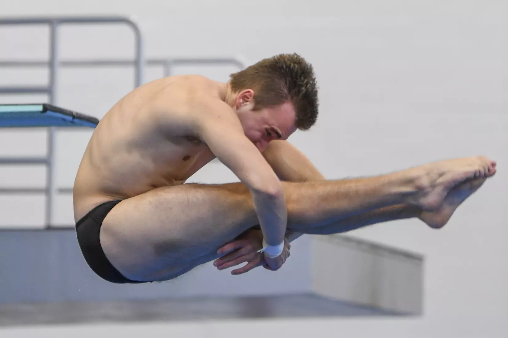 Nick Cover dives in the three meter event.