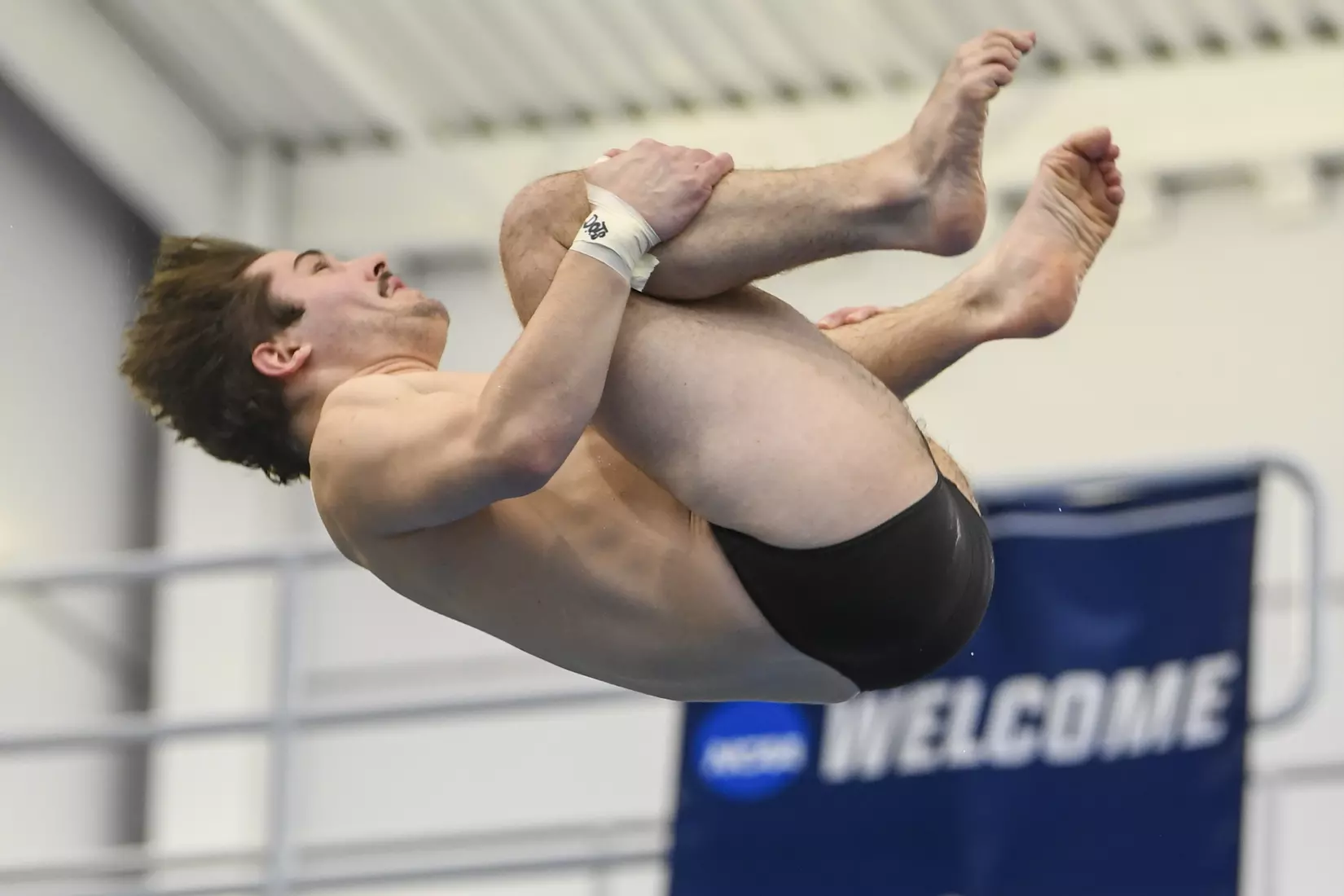 Jake Lowe dives in the three meter event.