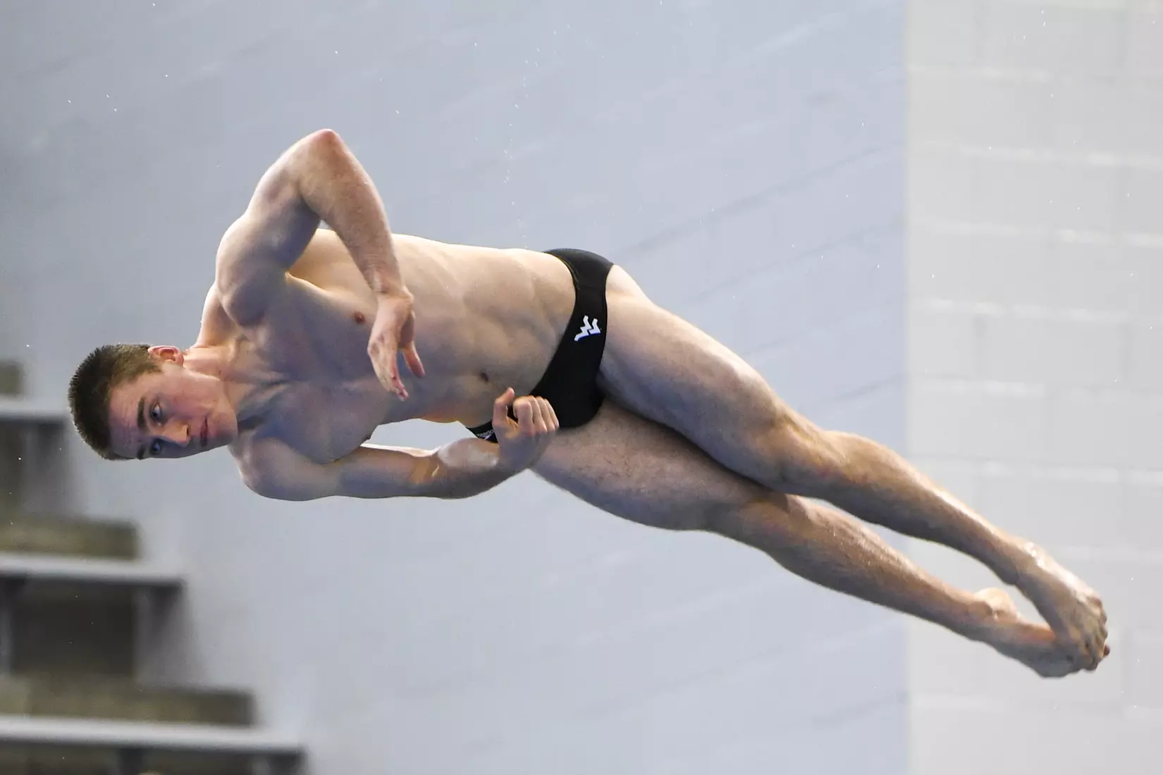 Jacob Cardinal Tremblay dives in the three meter event.
