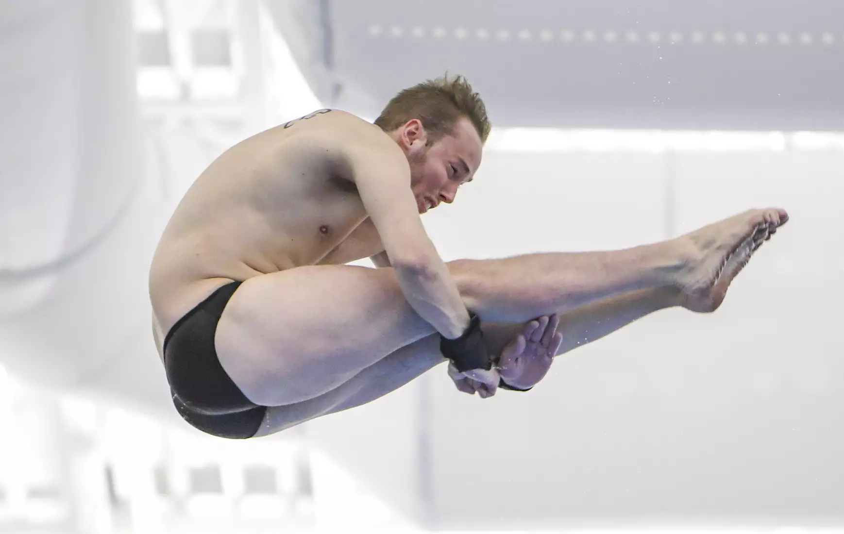 Austin Smith competes in the NCAA Zone platform diving competition.